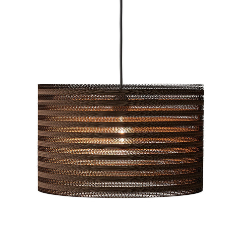 Handcrafted cardboard pendant showcasing eco-friendly design and stylish decor for sustainable living
